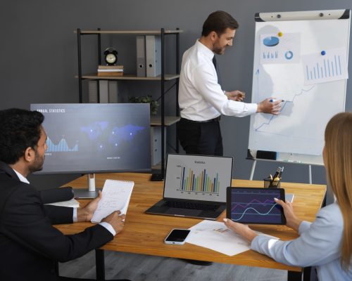 business-person-looking-finance-graphs business-person-looking-finance-graphs